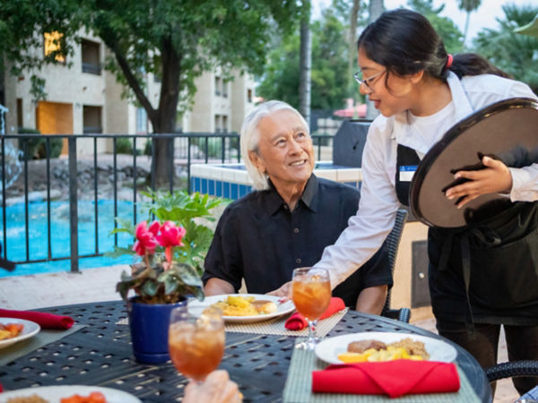 Server Bringing Resident Dinner