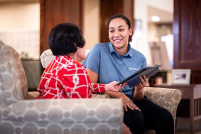 Associate showing resident Ipad