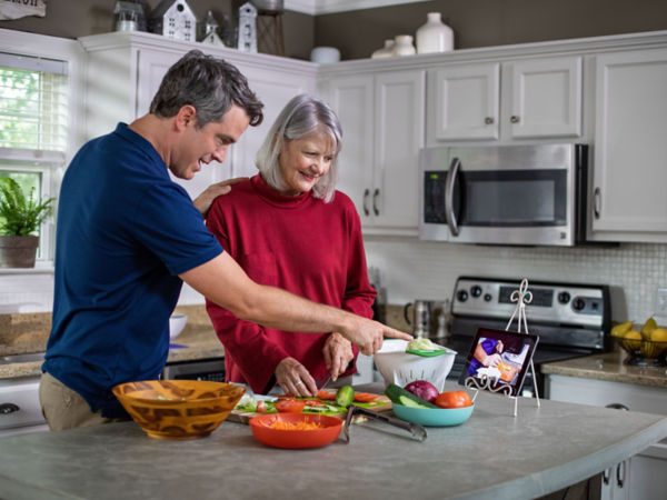 Caregiver Helping Resident With Cooking