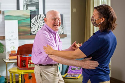 caregiver and man dancing