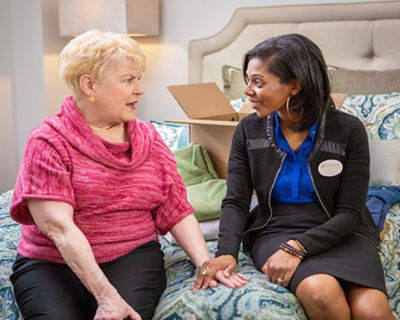 Caregiver talking to resident