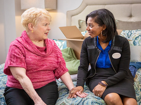 Caregiver talking to resident