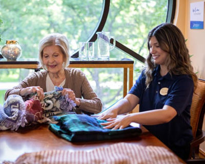 Woman and associate looking at fabric