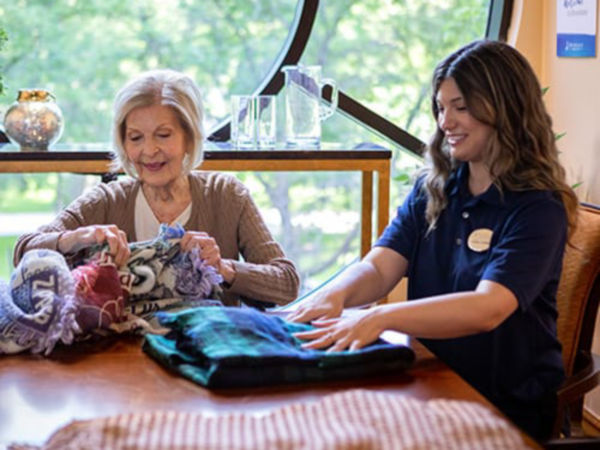 Woman and associate looking at fabric