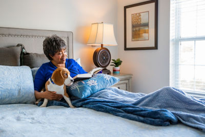 Resident Reading With Beagle