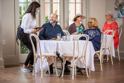 Server taking a couple's order